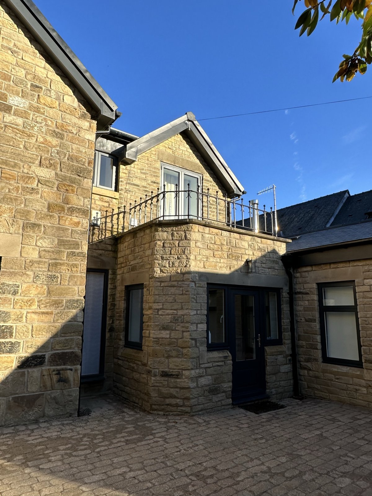 Stone home extension and renovation in Sheffield by Unity Development Group