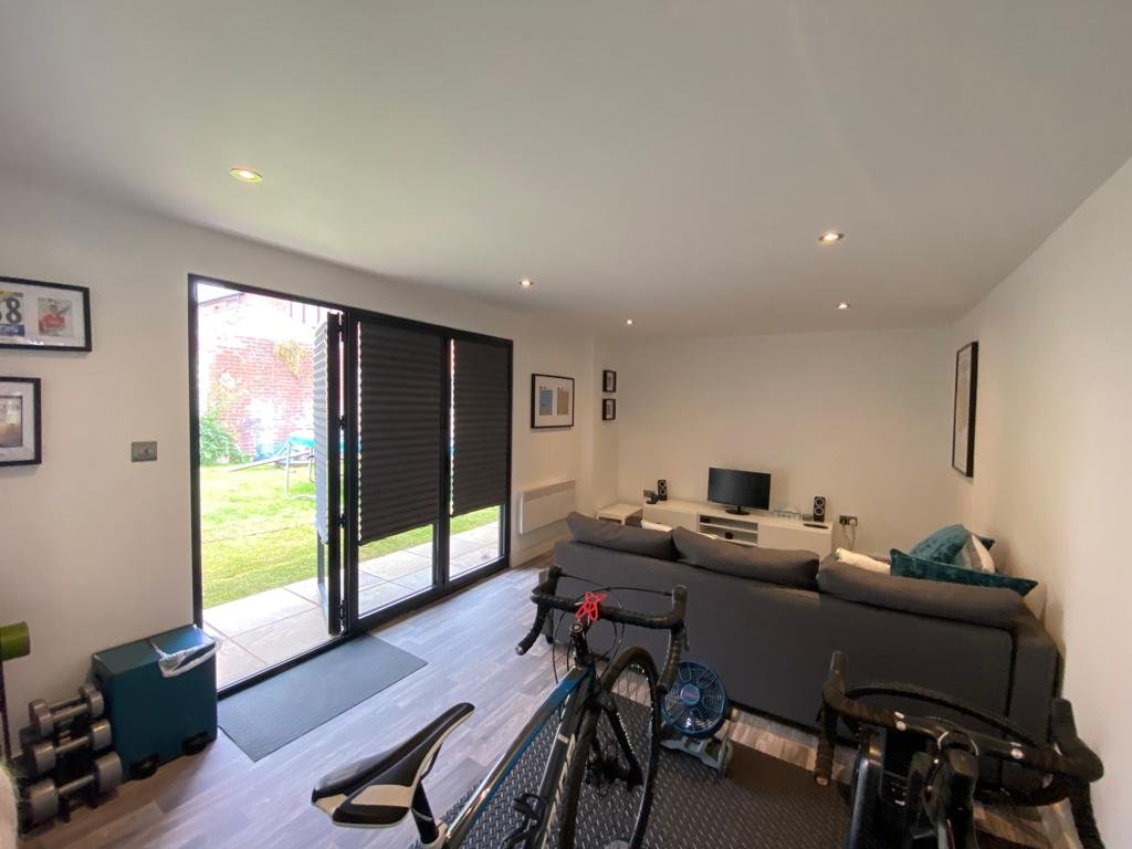 Bespoke garden room with home gym and media space in Sheffield by Unity Development Group